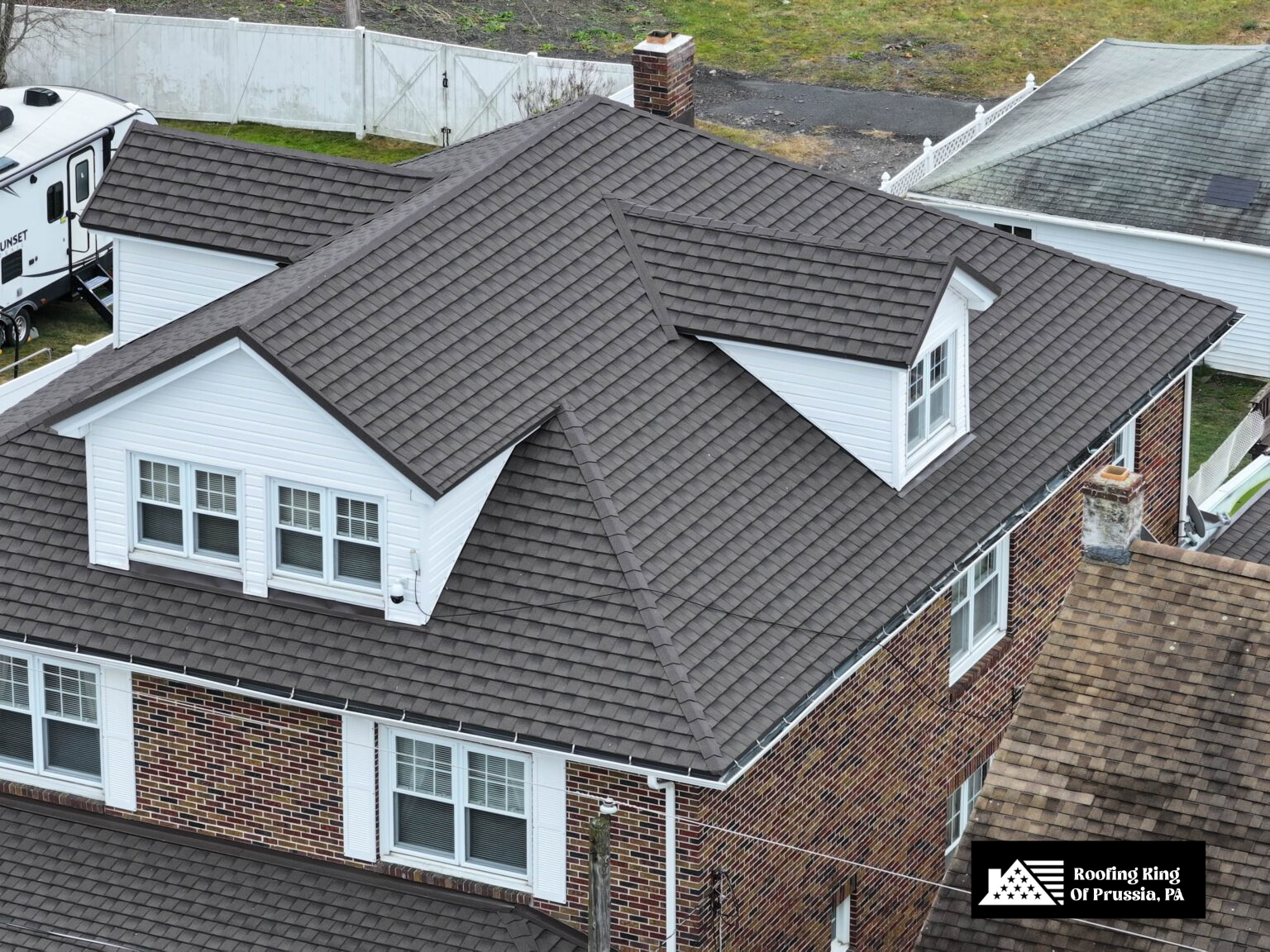 Brick home with a durable, weather-resistant asphalt shingle roof.