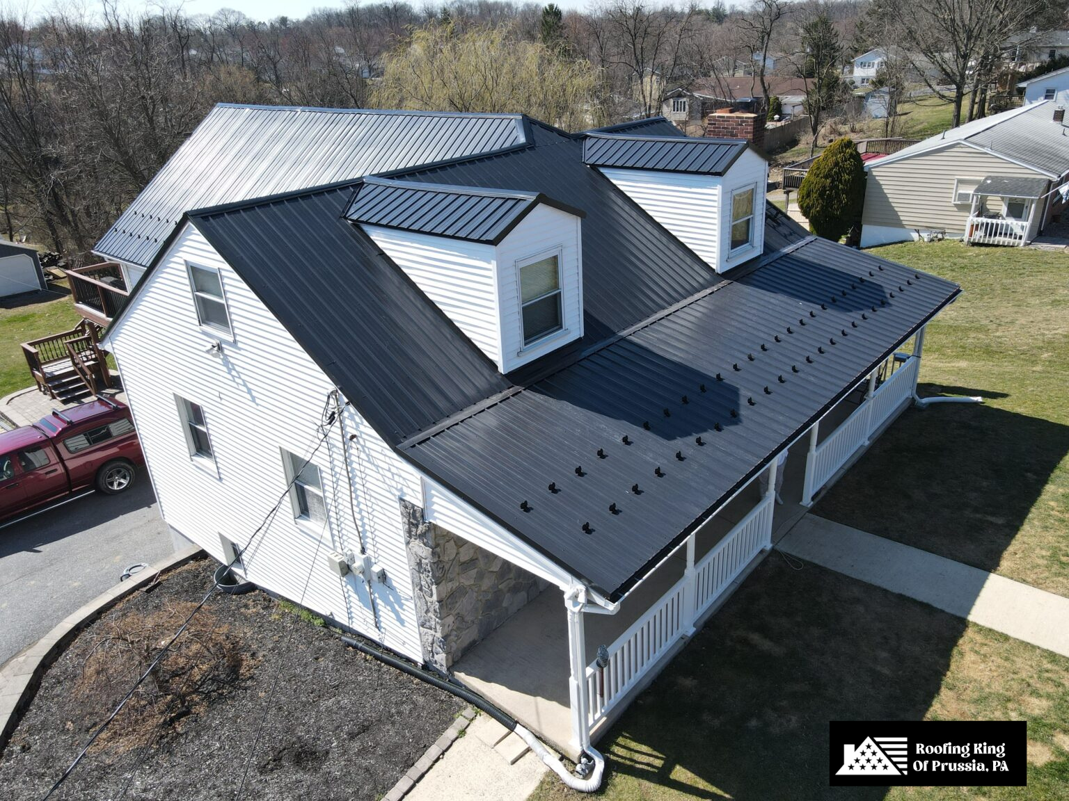 Large residential home with a newly installed blue shingle roof.